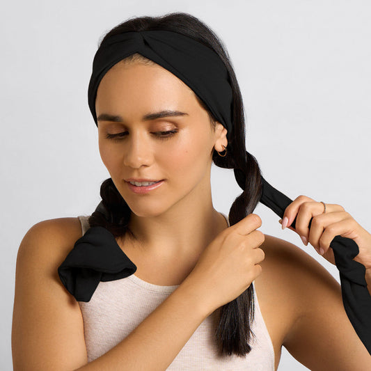 KITSCH Set & Flow Active Headband in Black — model wearing headband as a sleep headband — soft, stretchy design protects curls and waves overnight