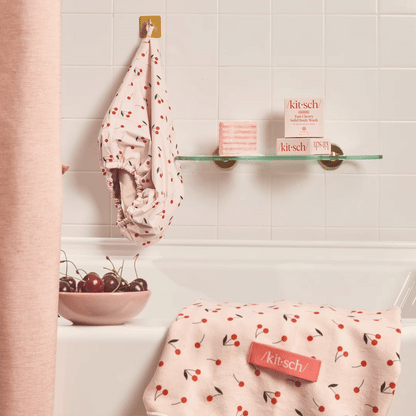 KITSCH Cleansing Tart Cherry Solid Body Wash — animated lifestyle product shot — Infused with a refreshing scent reminiscent of tart black cherries — made in the USA, Vegan, Cruelty Free, Leaping Bunny Certified