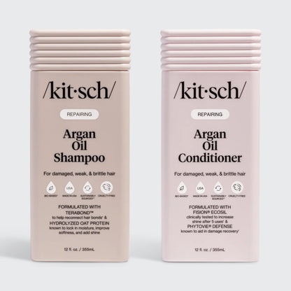 KITSCH Repairing Argan Oil Shampoo 12 fl. oz. & Conditioner 12 fl. oz. Combo — both labeled REPAIRING, For damaged, weak, & brittle hair — icons: Bio-Based, Nontoxic, Sustainably Sourced, Cruelty-Free — Shampoo formulated with Terabond™ & Hydrolyzed Oat Protein; Conditioner formulated with Fision® EcoSil & PhytoVie® Defense